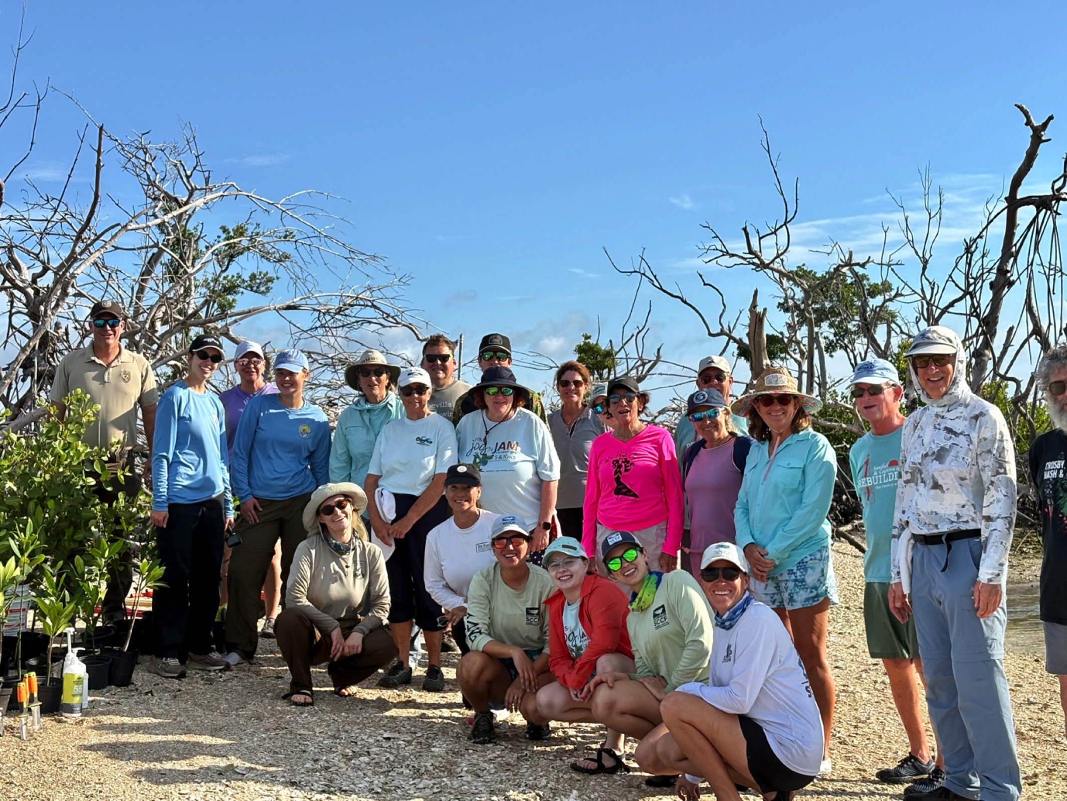 Club members gathered for a community cleanup event on the water
